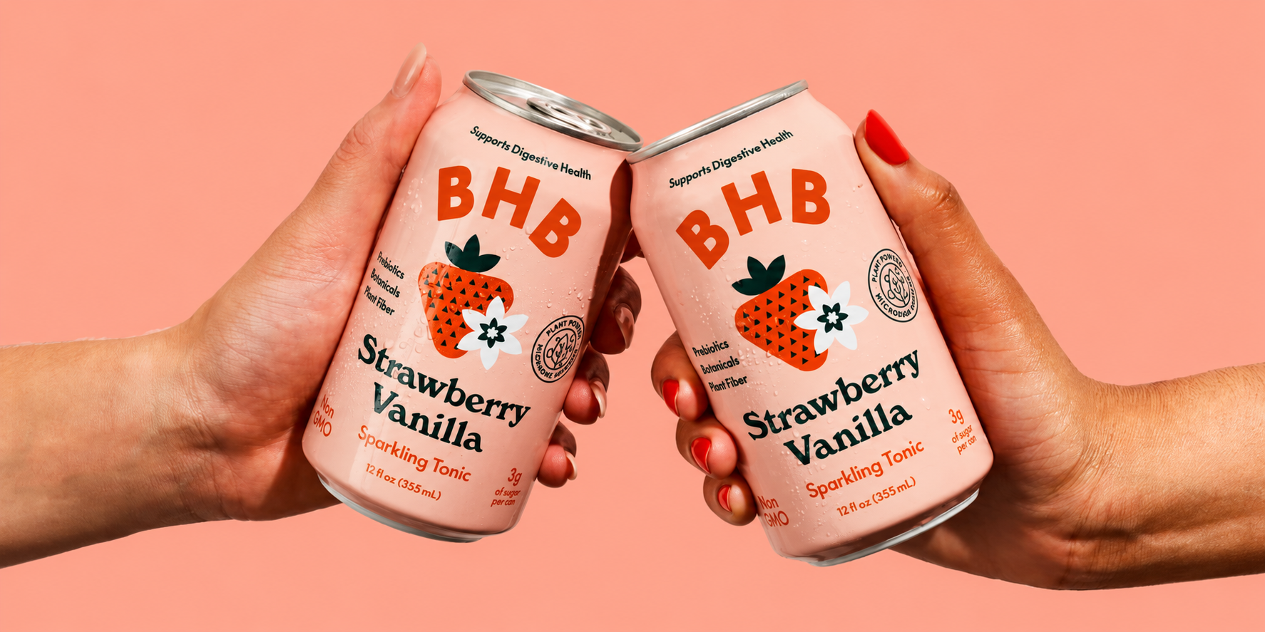 Strawberry vanilla cans raised for a toast