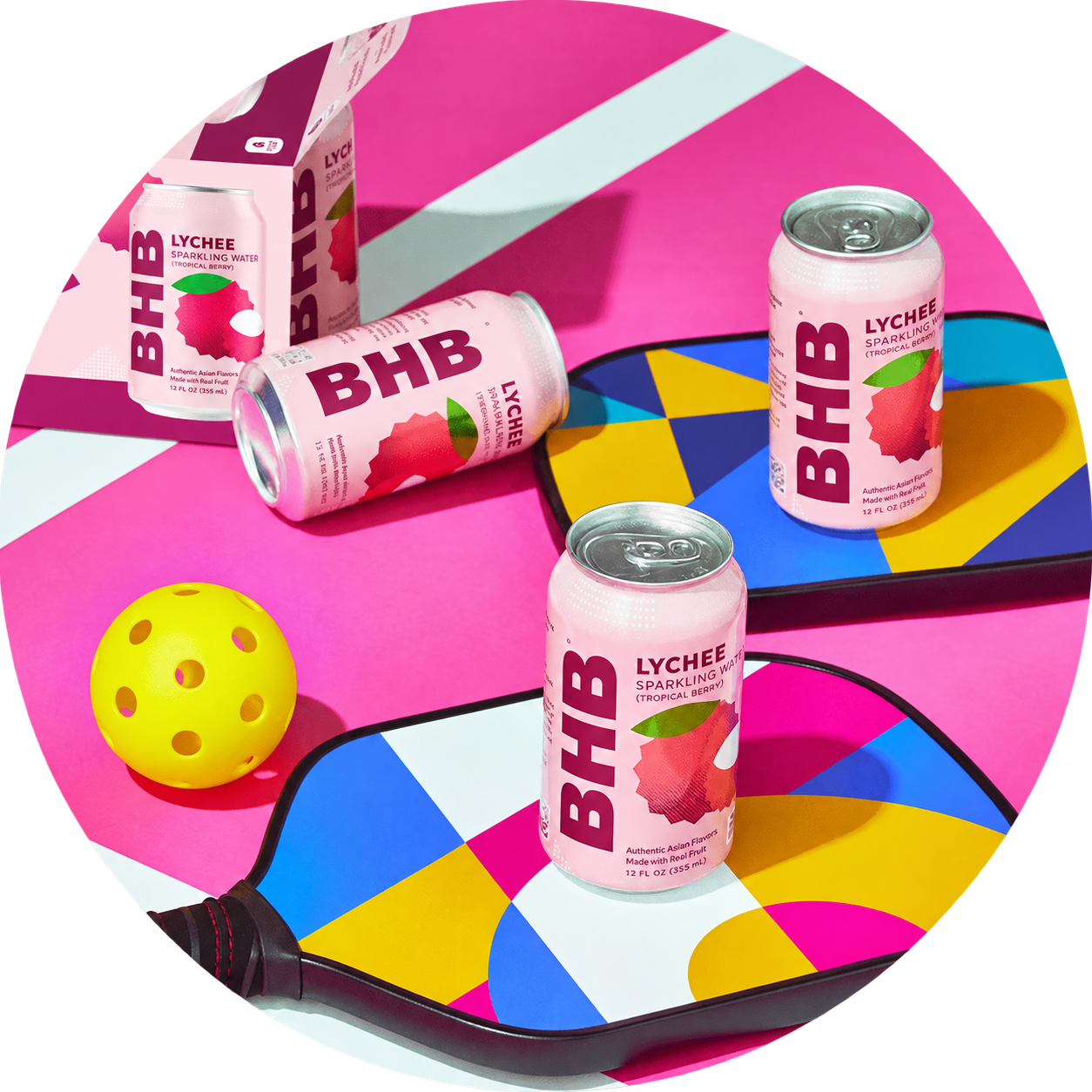 Lychee cans and twelve-pack box at a pickleball court